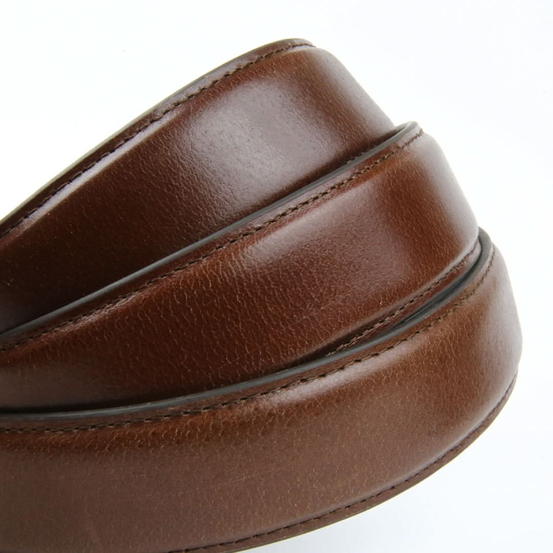 A tan brown ratchet belt strap featuring a combination of black and brown leather for a stylish and versatile look.

belt without holes, ratchet belt strap, leather straps, ratchet belt strap only, adjustable strap, belt strap without holes, belt strap without buckle, micro adjustable belt strap	